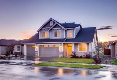 Suburban home at dusk after rain