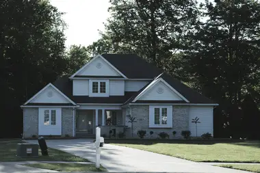 Two-storey home with a fresh dark gable roof